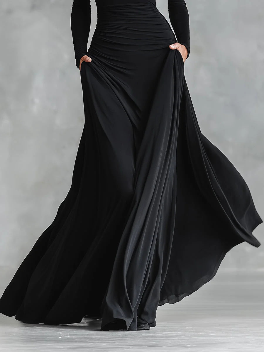 Full-length shot of black formal maxi dress with ruched bodice and flowing skirt