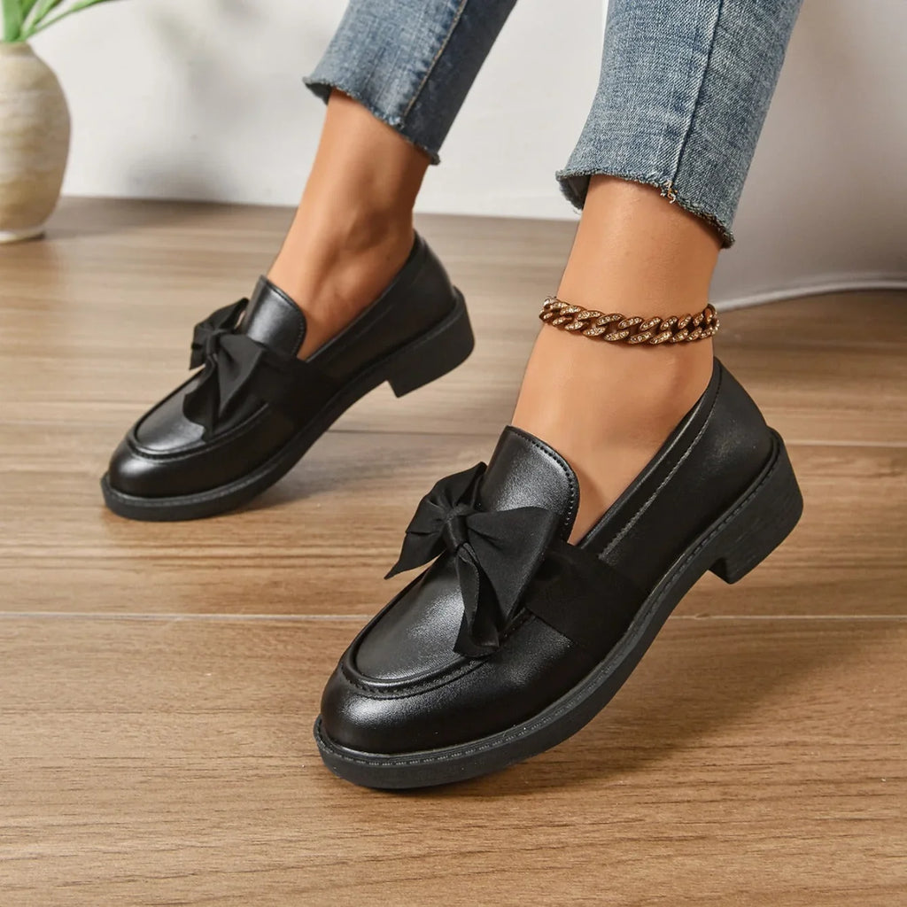 Detail of women's loafers showing rounded toe box and smooth finish