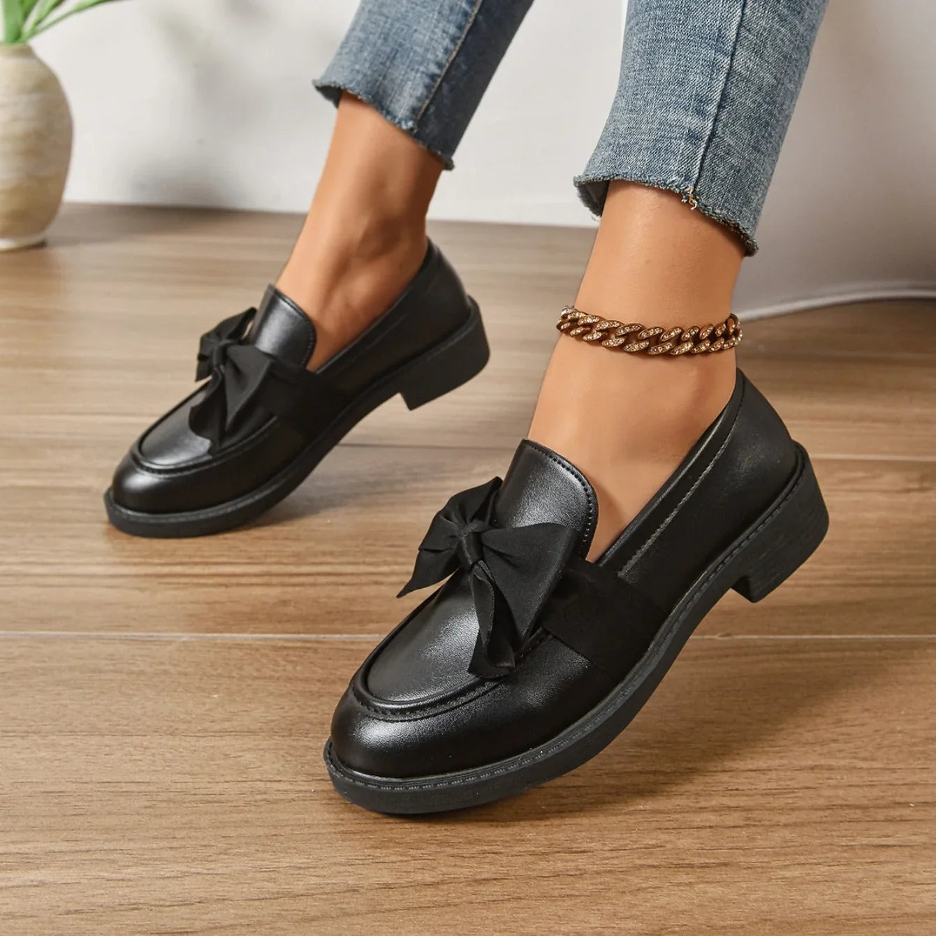 Detail of women's loafers showing rounded toe box and smooth finish