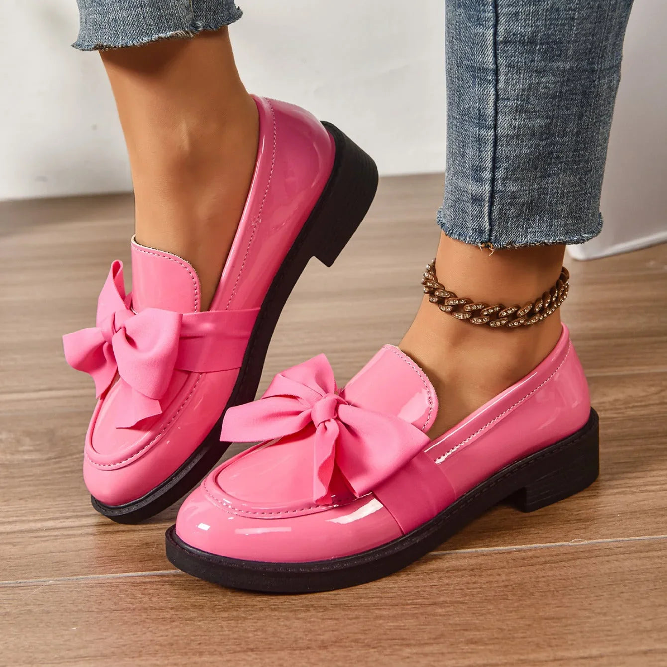 Close-up of bow detail loafers showing contrast bow accent and rounded toe