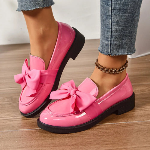 Close-up of bow detail loafers showing contrast bow accent and rounded toe