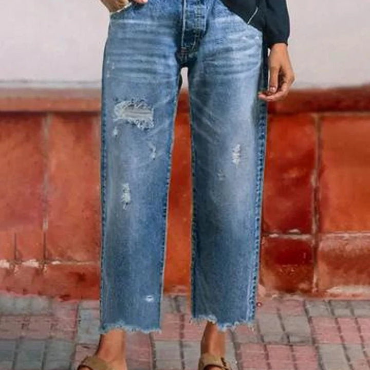 Front detail of high-waist cropped jeans with button-fly and pockets