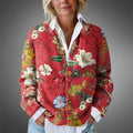 Women's floral knit cardigan with vintage botanical print and relaxed fit, styled over white collared shirt