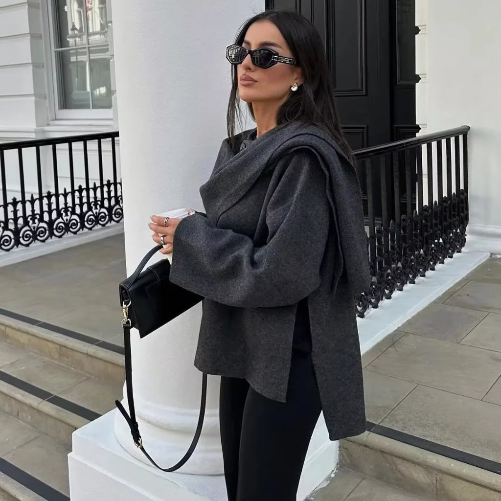 Women's wrap coat showing textured fabric and relaxed autumn silhouette