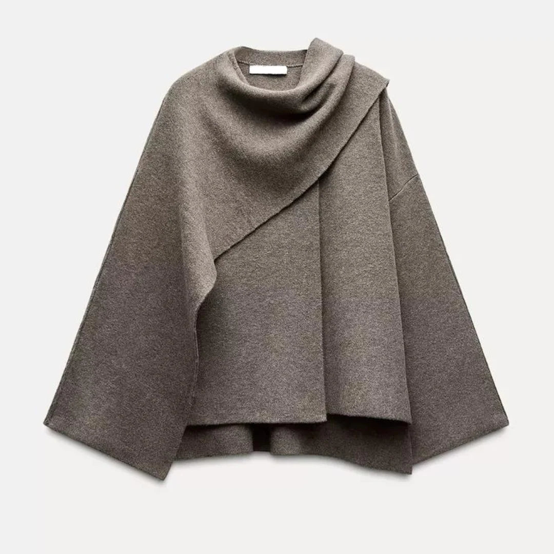 Oversized wrap coat showing open front design and relaxed draping detail