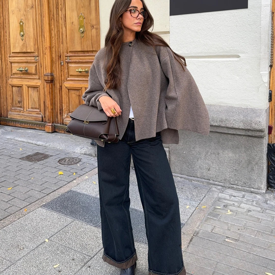 Wrap coat in taupe showing relaxed fit and flowing sleeve detail