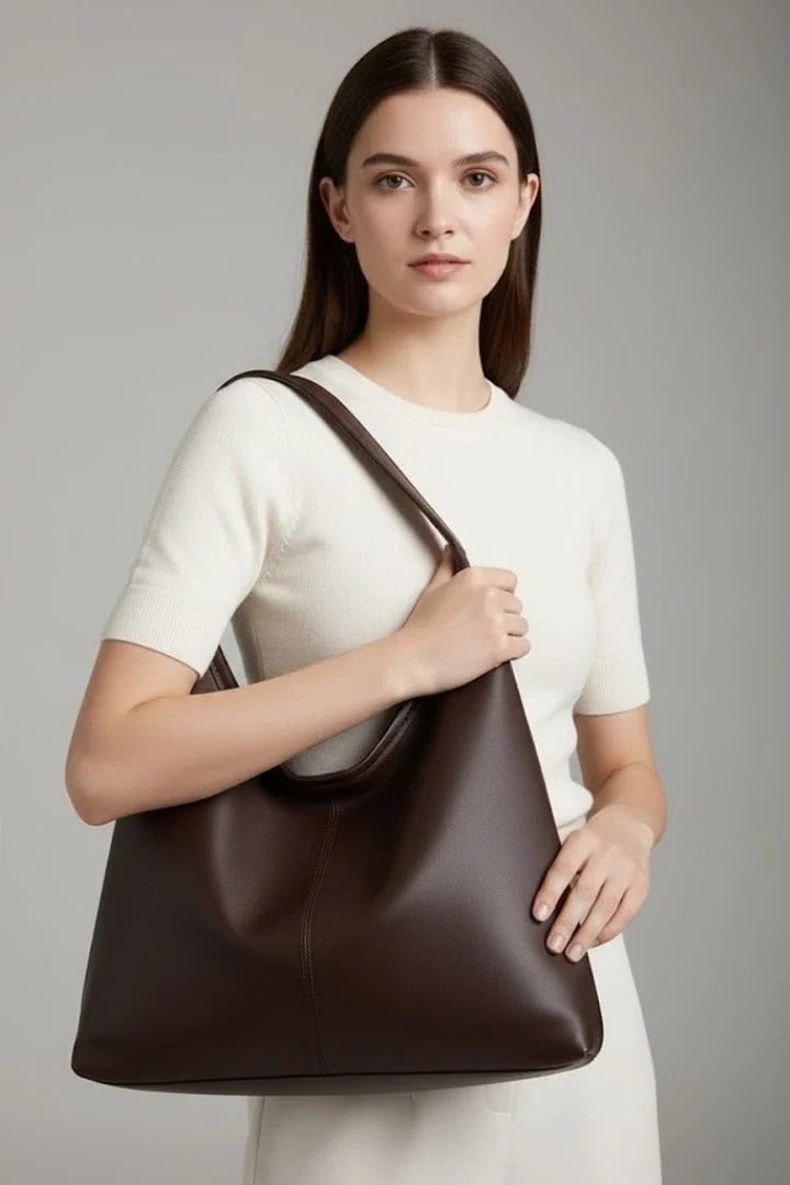 Side view of women's hobo bag showing soft structured silhouette and adjustable shoulder strap