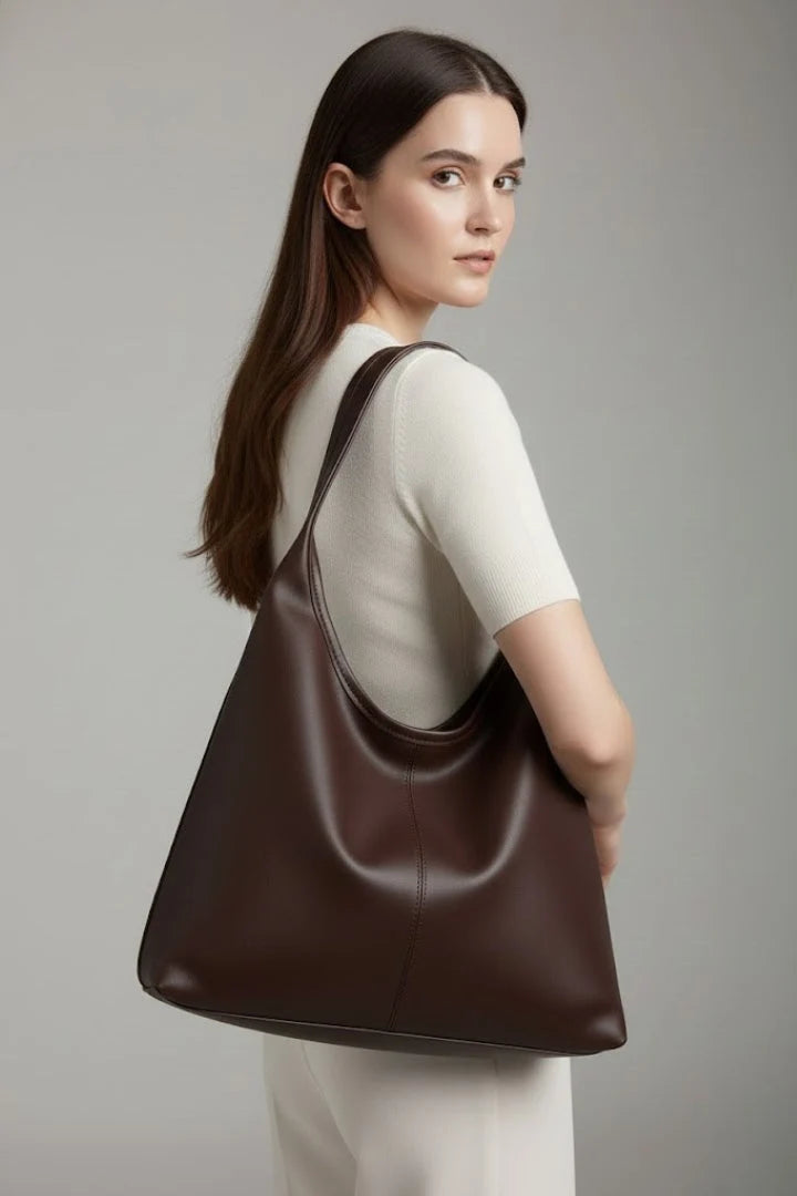 Detail shot of centre stitching line and soft structured panels on women's hobo bag