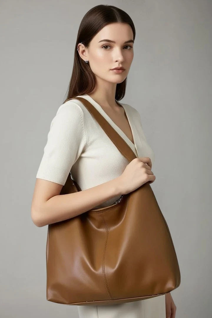 Women's hobo bag in chocolate brown showing curved silhouette and versatile neutral tone