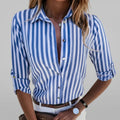 Women's striped shirt with vertical blue and white stripes, classic collar and roll-up sleeves in relaxed fit