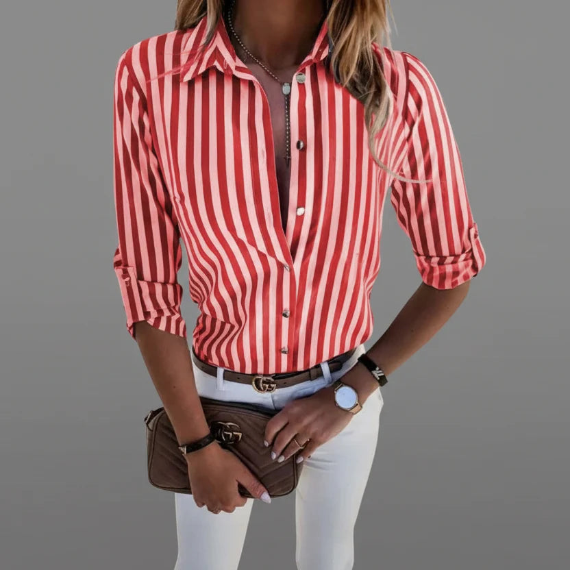 Close-up view of women's striped shirt showing button-front closure and structured collar detail with vertical stripe pattern