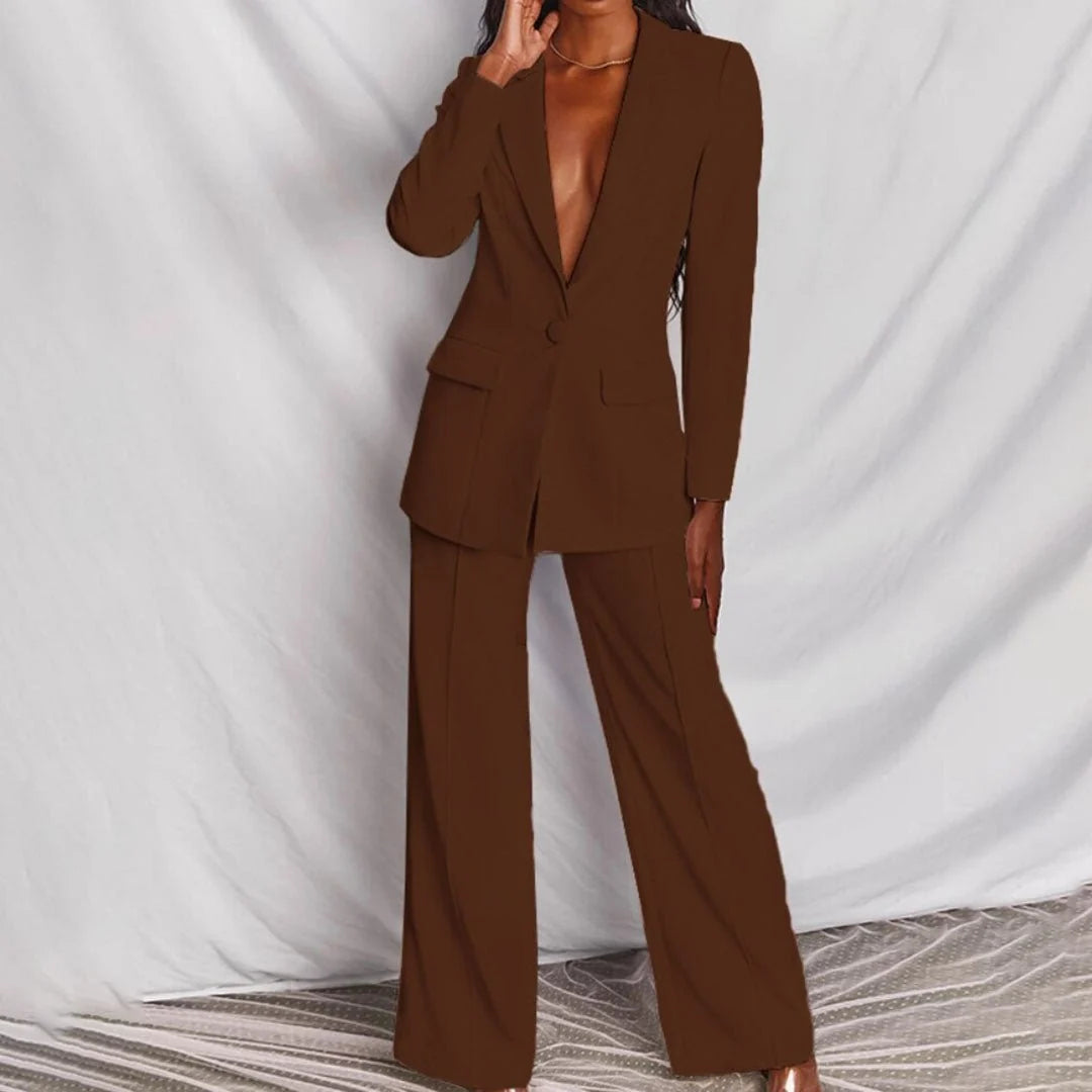 White women's tailored suit set with structured blazer and full-length trousers