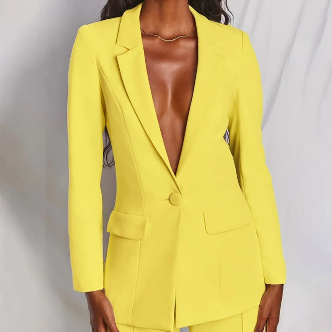 Close-up of single-button closure and notched lapel on women's tailored blazer