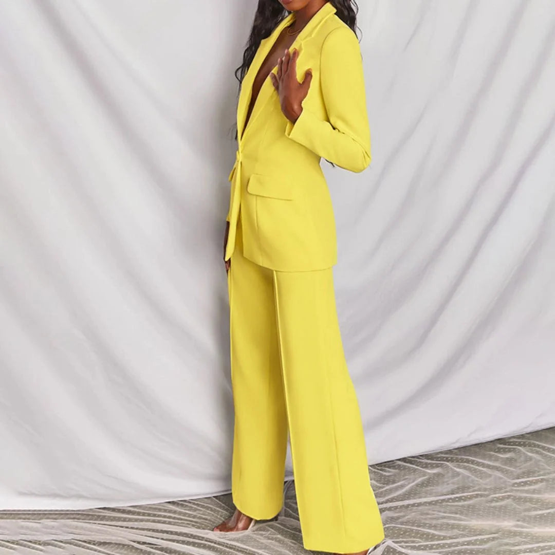 Side view of women's suit set showing structured shoulders and straight trouser cut