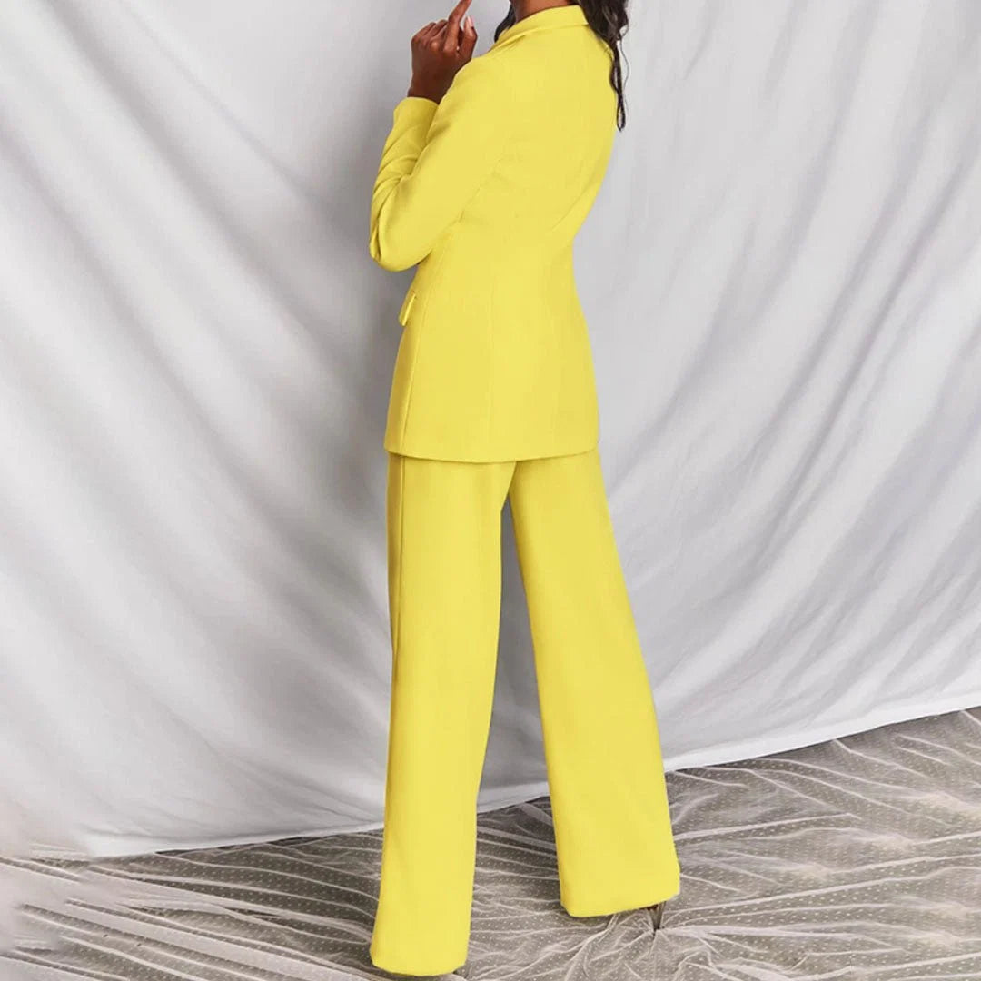 Back view of women's tailored suit set with clean seams and full-length trousers