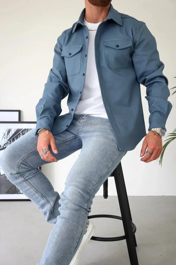 Full outfit styling with men's overshirt, white tee, and dark denim jeans