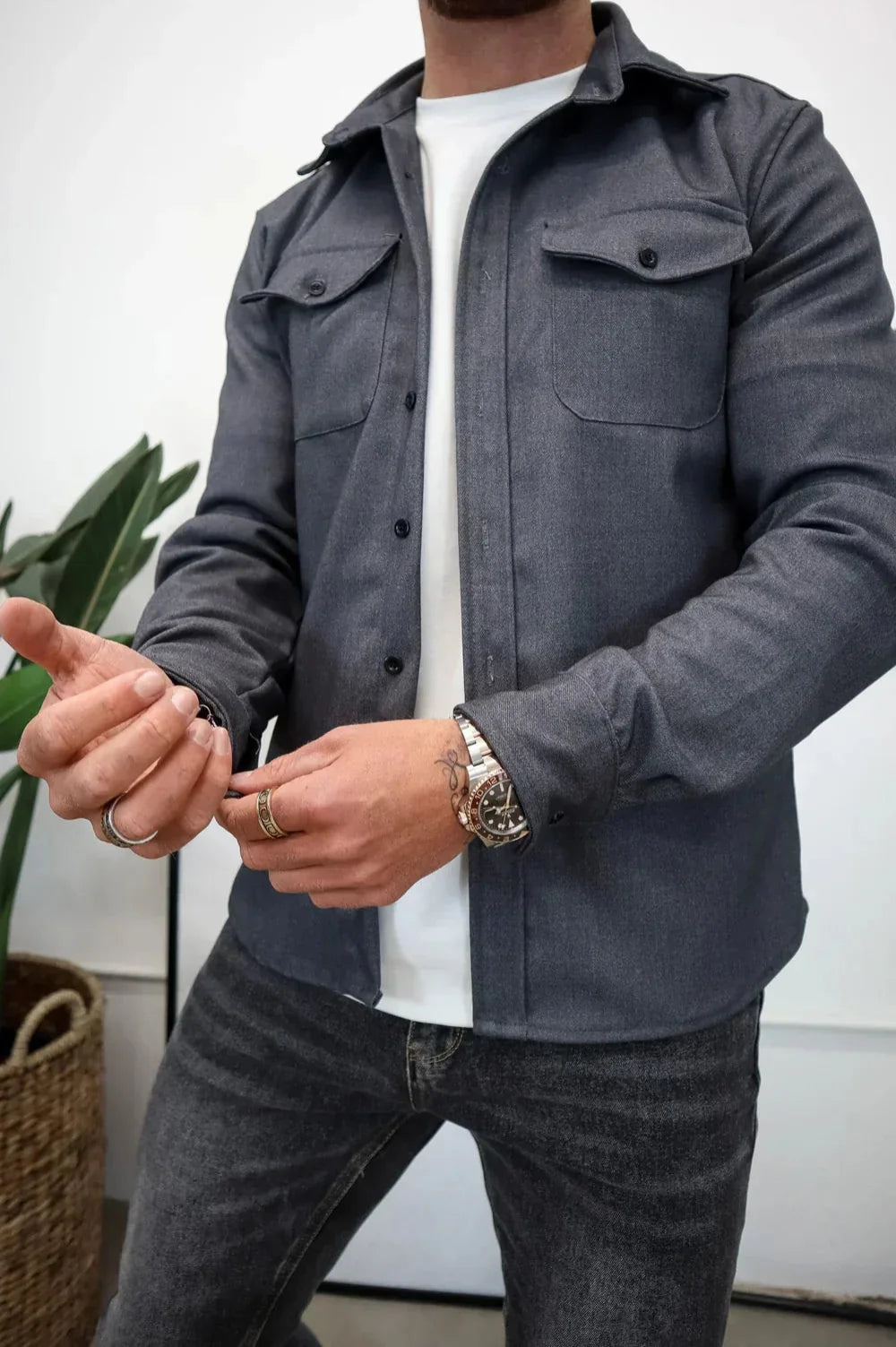 Full-length view of men's overshirt showing relaxed silhouette and shirt-tail hem