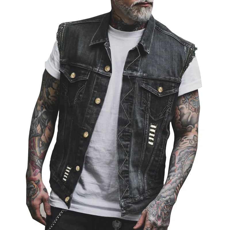 Close-up view of men's sleeveless denim vest showing frayed armholes and chest pockets