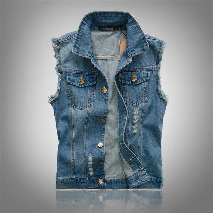Men's denim vest styled over white tee showcasing rugged casual aesthetic