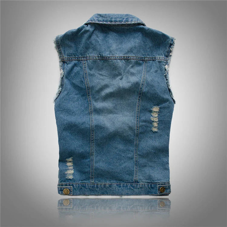 Detail shot of chest flap pockets with button closures on men's denim vest