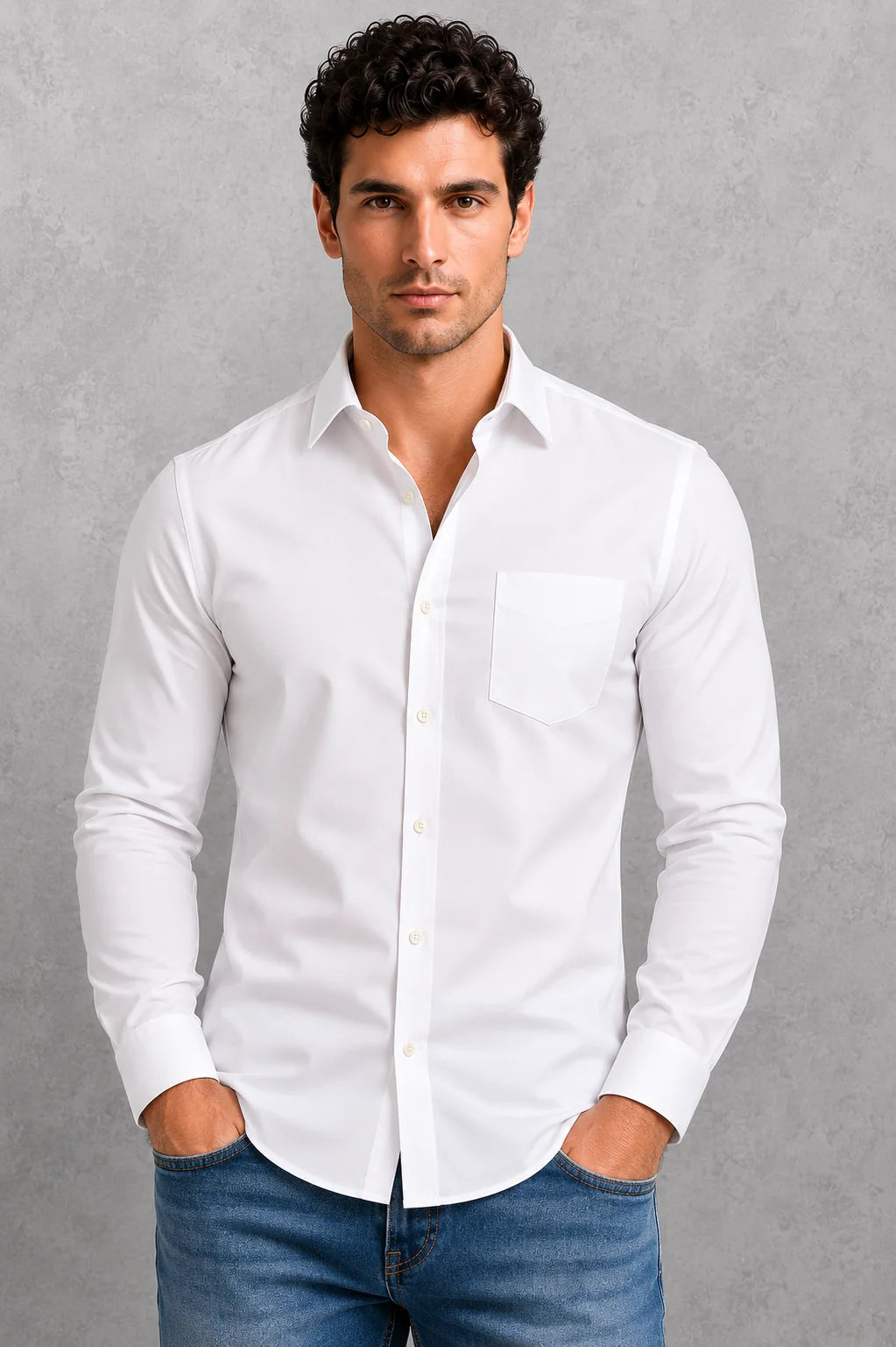 Men's formal shirt in white with classic point collar and long sleeves, styled with denim jeans