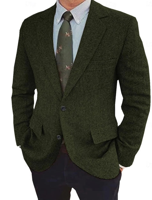 Close-up view of men's herringbone tweed blazer showing structured woven fabric texture and button detail