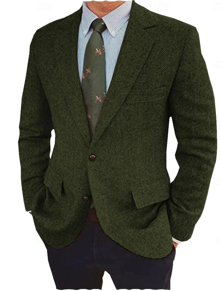 Men's brown tweed blazer with herringbone pattern worn with navy trousers for smart casual styling