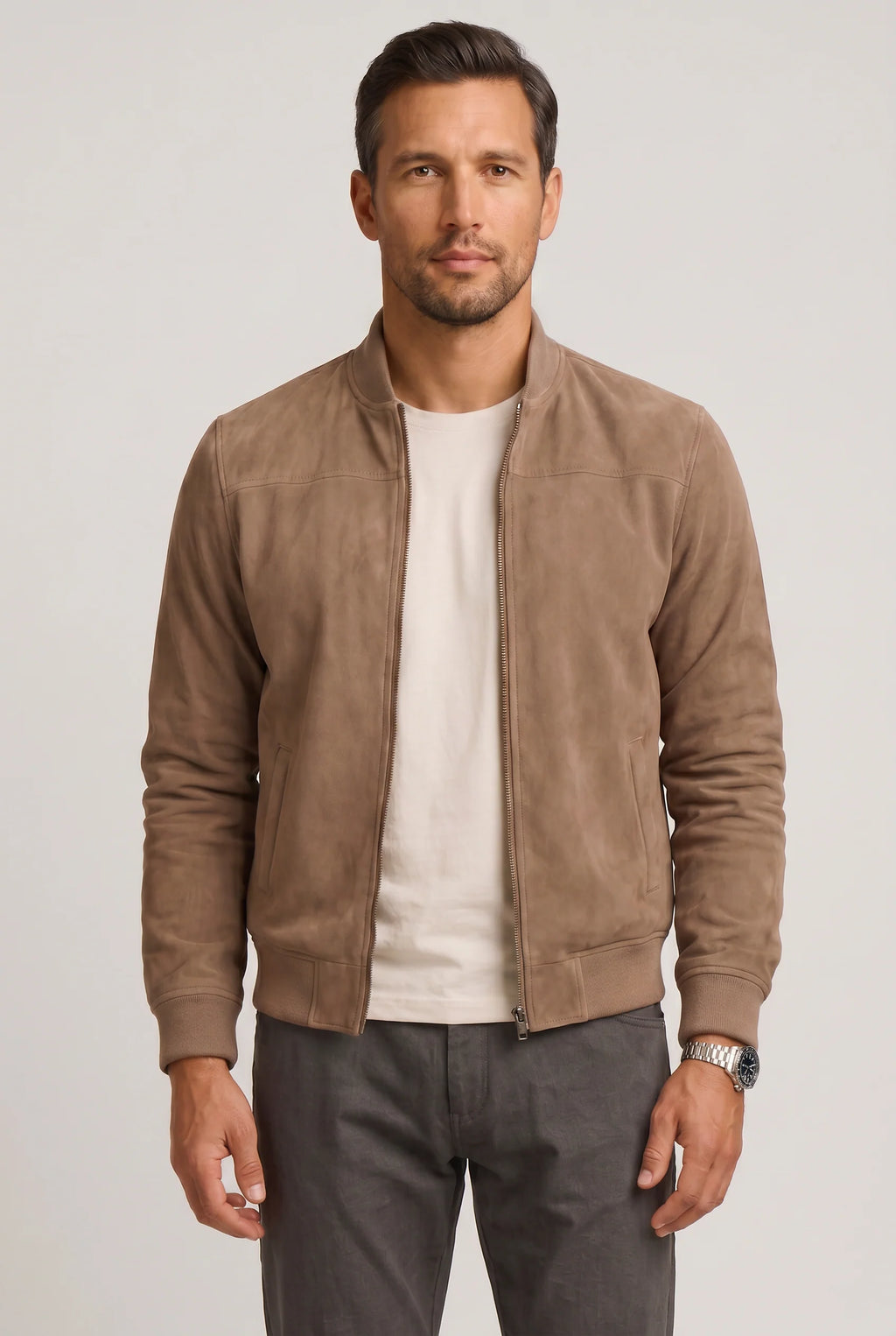 Men's suede bomber jacket in beige with ribbed cuffs and stand collar, front view on model