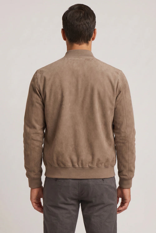 Close-up of men's bomber jacket showing soft suede finish and front zip closure detail