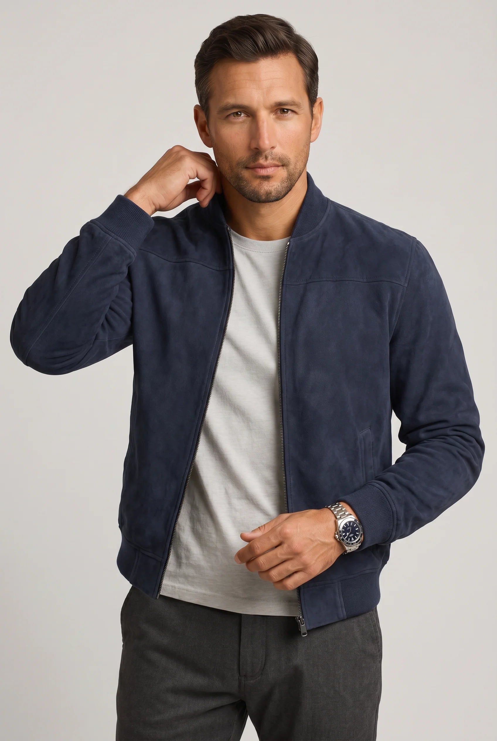 Back view of men's bomber jacket showing structured shoulders and streamlined cut