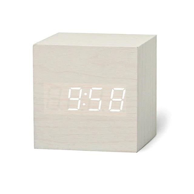 Minimalist digital cube clock with night mode dimming feature for bedroom use