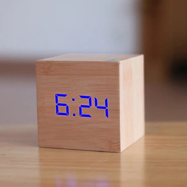 Compact 6cm cube alarm clock with bright LED display and temperature reading feature