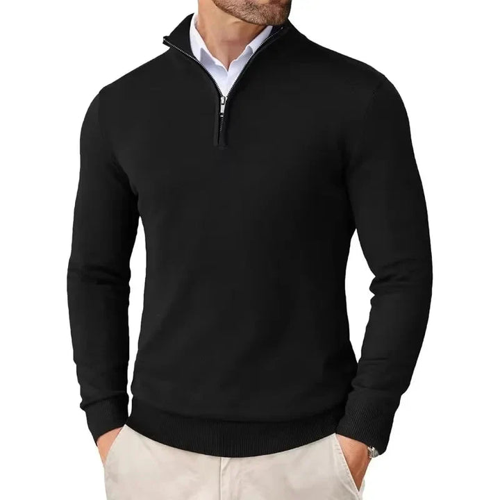 Men's half-zip jumper in black with ribbed collar and cuffs, styled over a white collared shirt