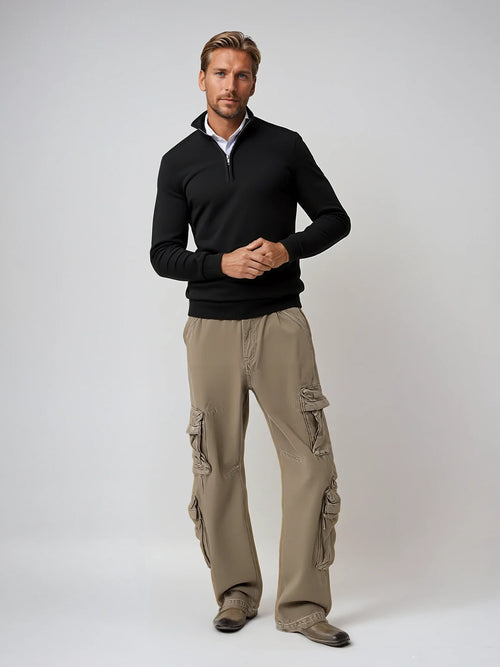 Close-up view of men's half-zip jumper showing metal zip pull and ribbed collar detail