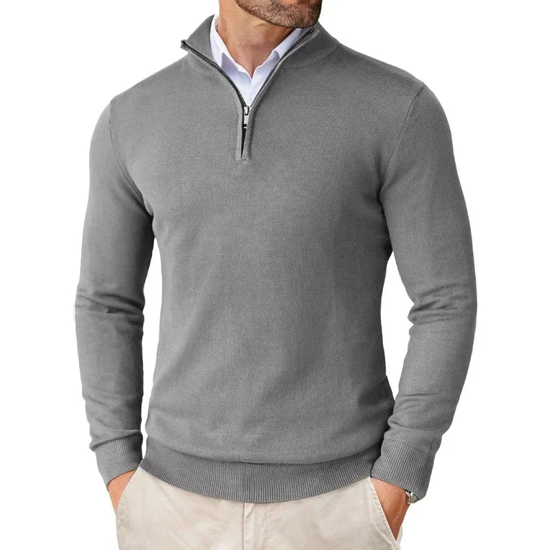Detail shot of men's half-zip jumper cuff showing ribbed knit texture