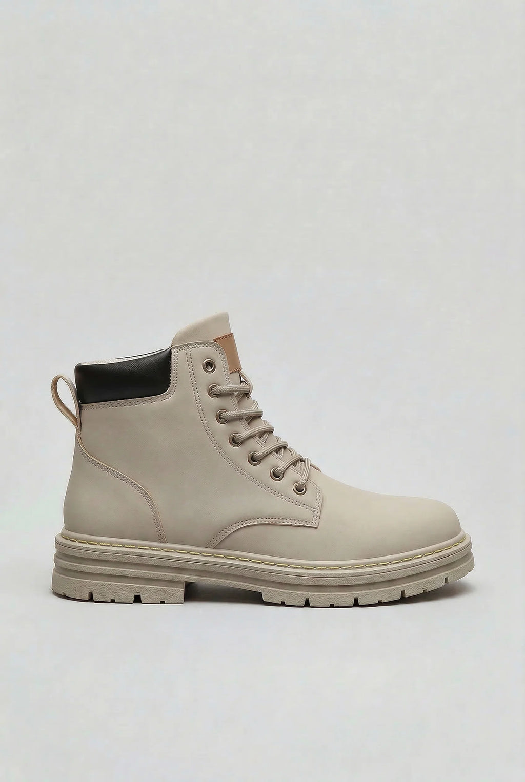 Men's lace-up boots with chunky lug sole in light grey, side profile view showing high ankle design