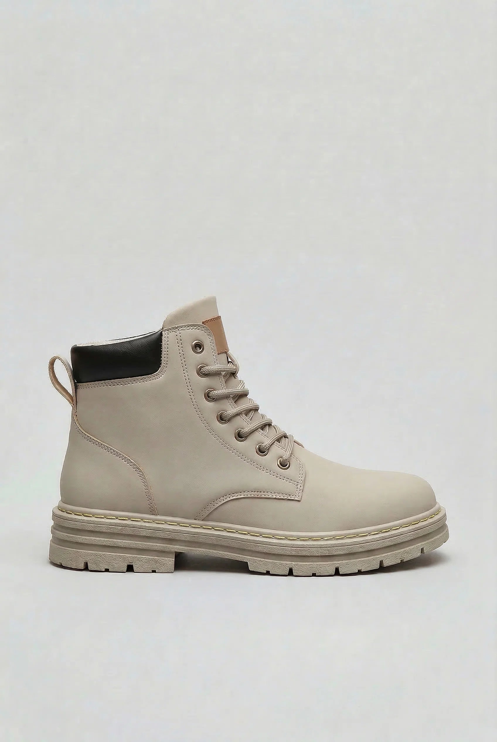 Men's lace-up boots with chunky lug sole in light grey, side profile view showing high ankle design