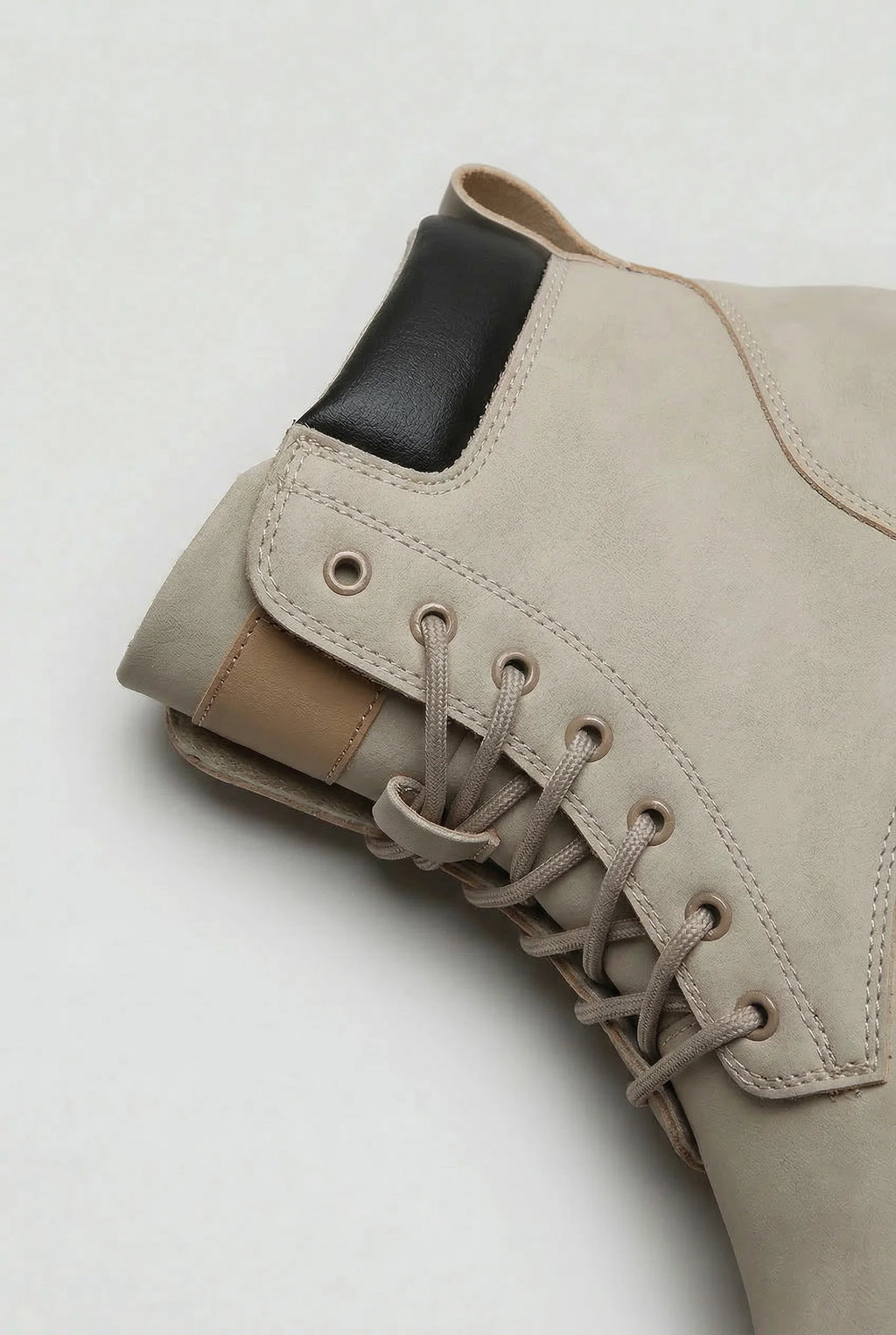 Chunky lug sole on men's lace-up boots providing grip and stability for everyday wear
