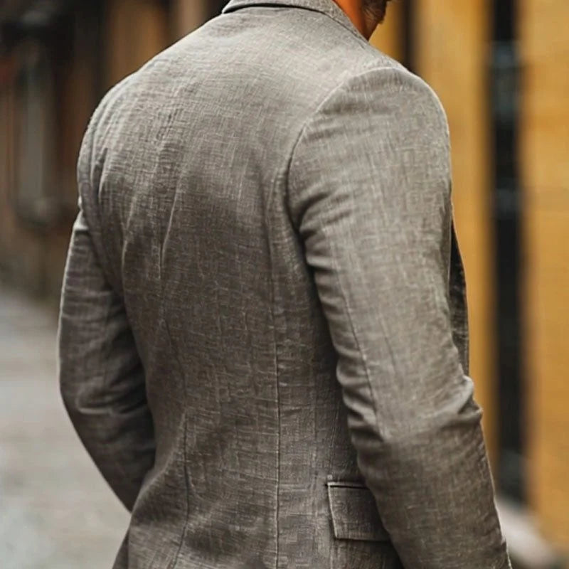 Men's linen blazer detail showing relaxed fit and breathable woven fabric construction