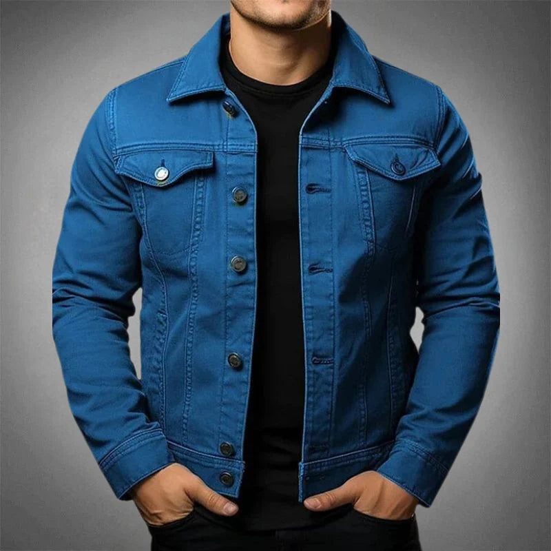 Close-up view of men's denim jacket showing button detail and structured fabric finish