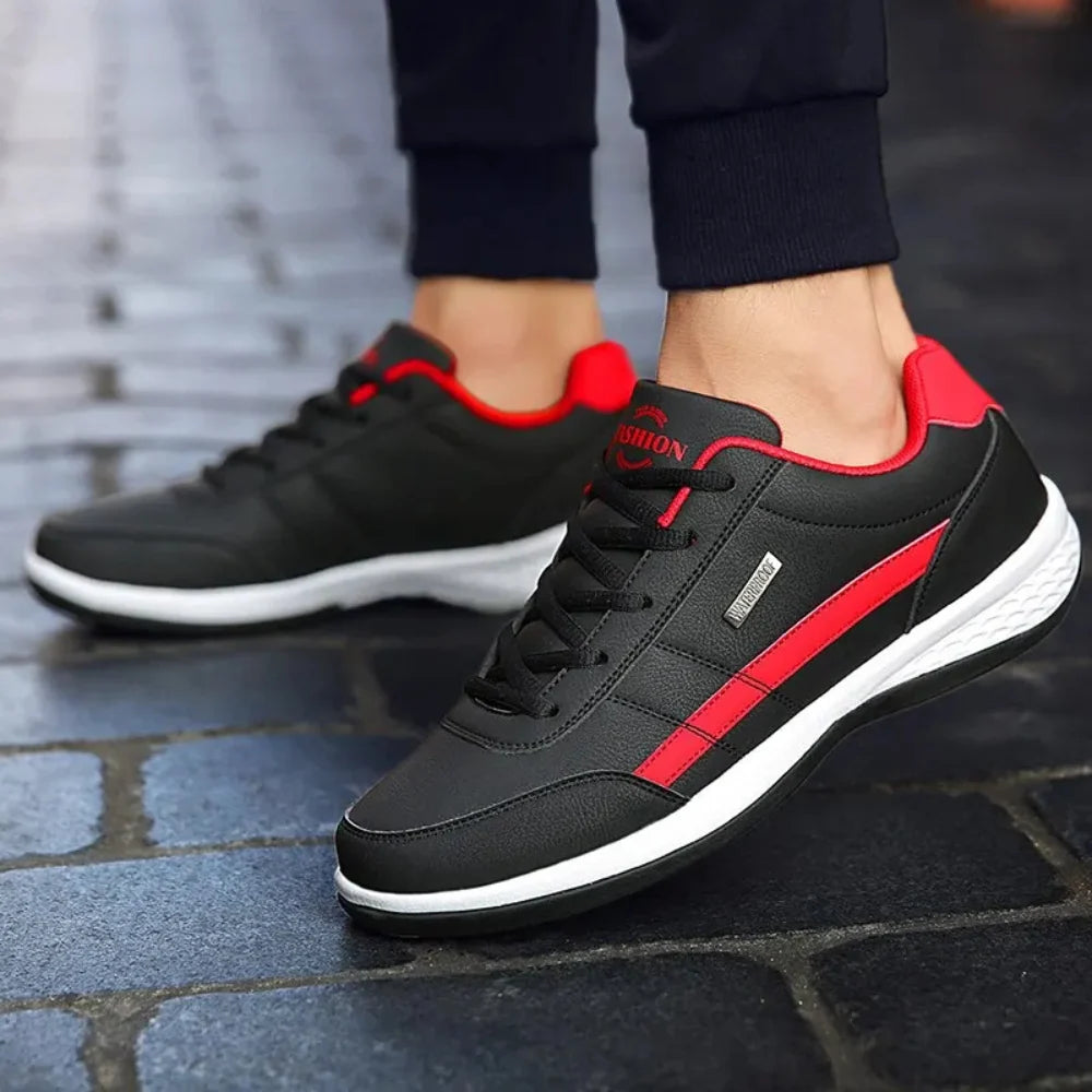 Close-up of men's leather trainers showing smooth upper and tonal stitching detail