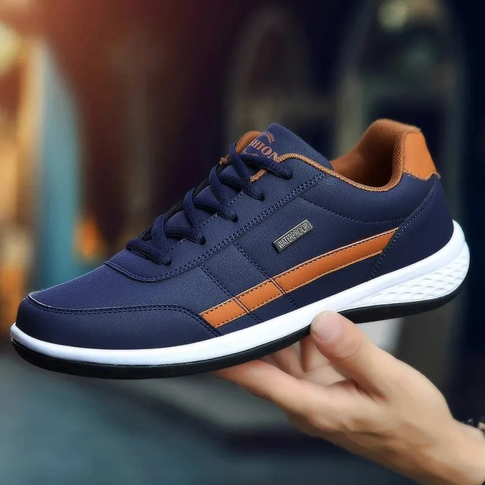 Detail of men's trainers featuring smooth leather finish and classic silhouette