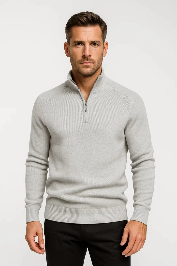 Side view of men's navy quarter-zip jumper displaying relaxed fit and raglan sleeve construction