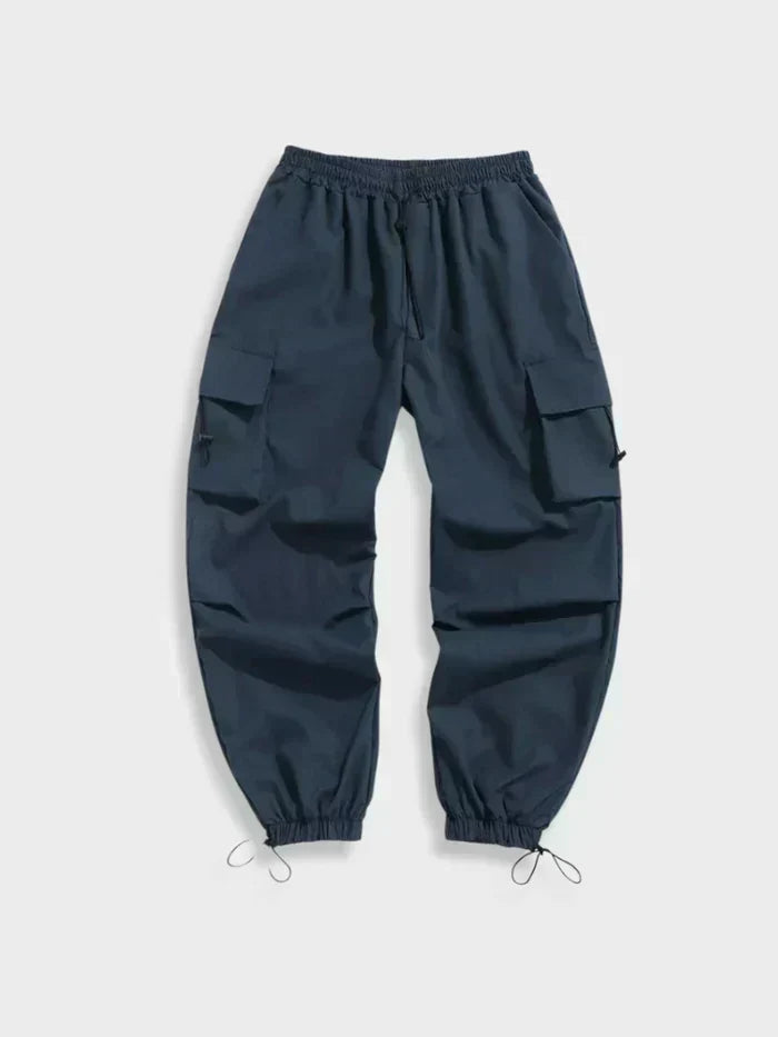 Close-up of cargo trouser pockets with flap closures and toggle fastenings