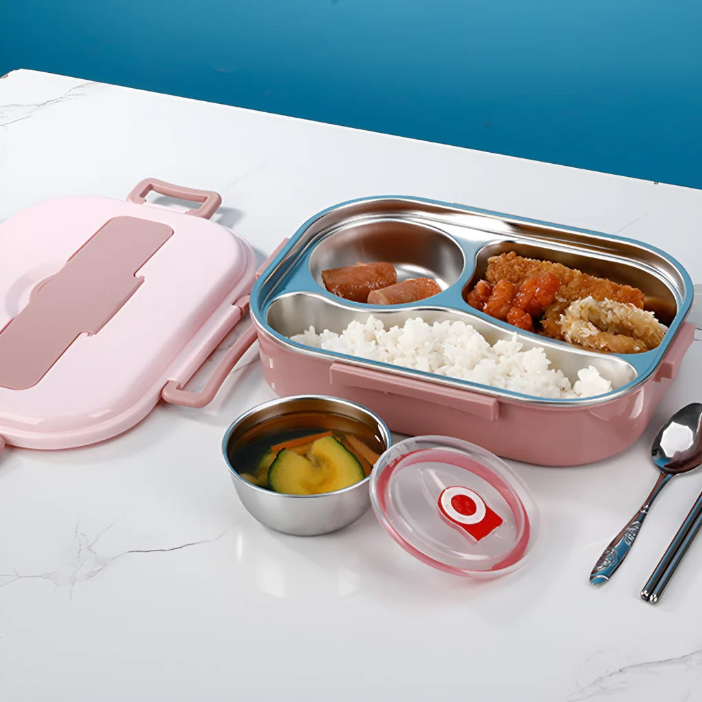 Stainless steel lunch box in pink with open lid showing three compartments filled with rice and fried food plus separate soup bowl
