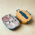Stainless steel lunch box interior showing three compartments and removable bowl for soups and sauces