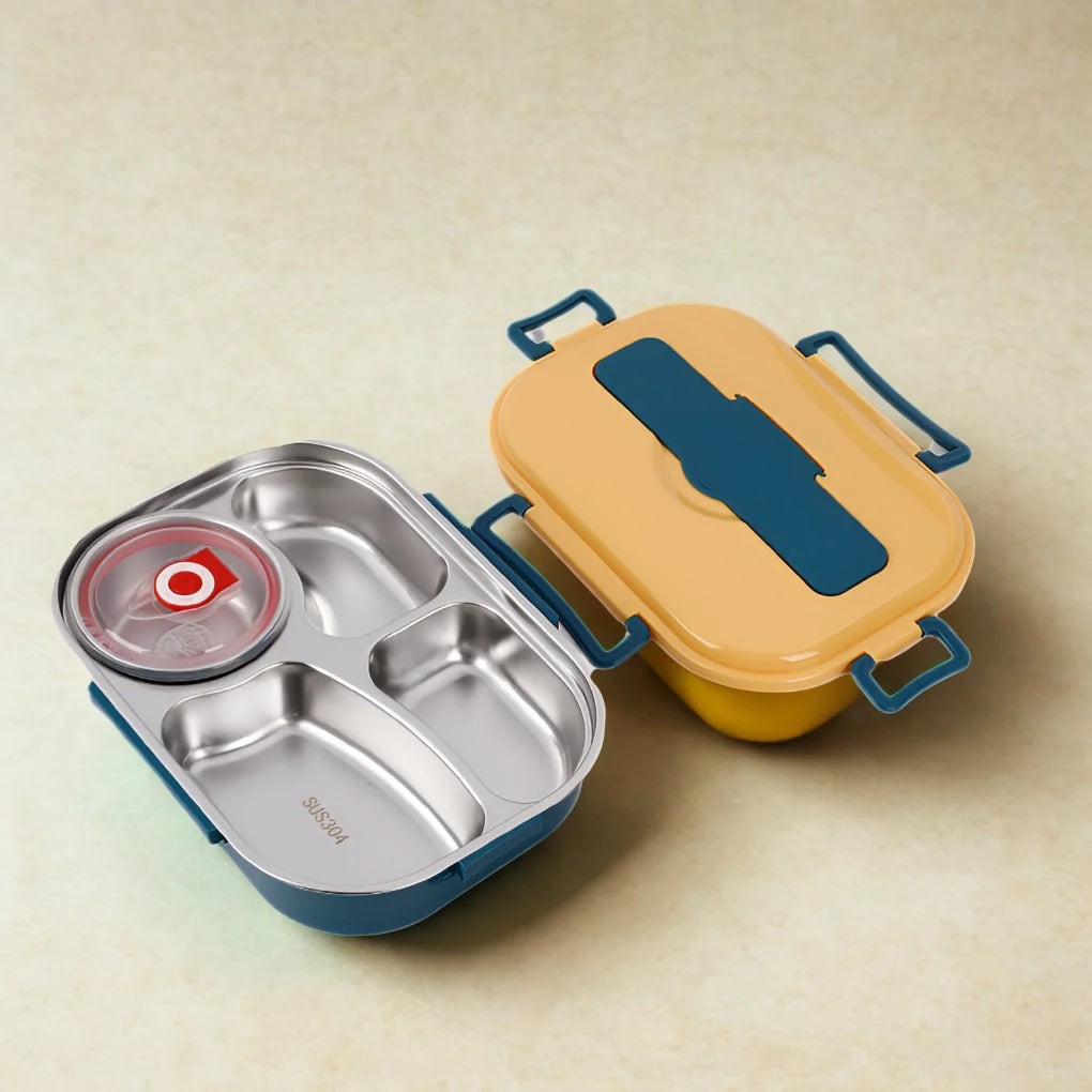 Stainless steel lunch box interior showing three compartments and removable bowl for soups and sauces