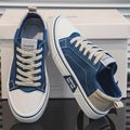 Women's canvas trainers in blue with beige laces and contrast stitching detail