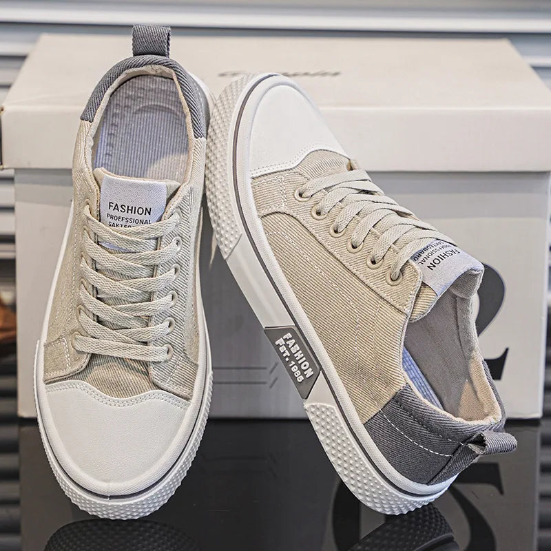Side view of women's blue canvas trainers with textured sole and pull tab