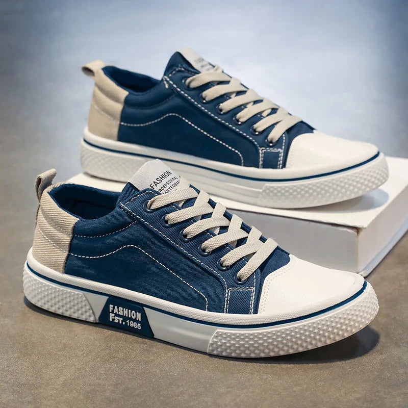 Detail of women's canvas trainers featuring contrast stitching and heel pull tab